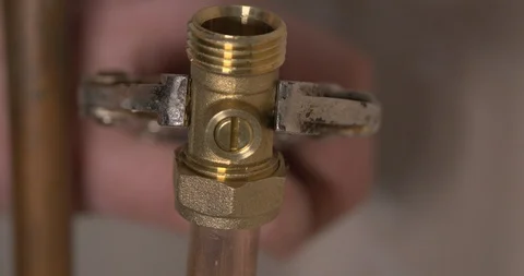 Tightening a compression joint valve on copper water pipe Video stock 101716771