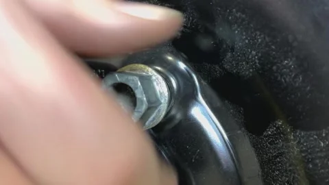 Tightening lug nut horizontal Stock Footage 305260980