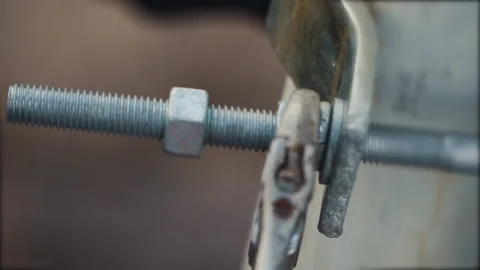 Tightening the nut with an adjustable wrench Stock Footage 244735242