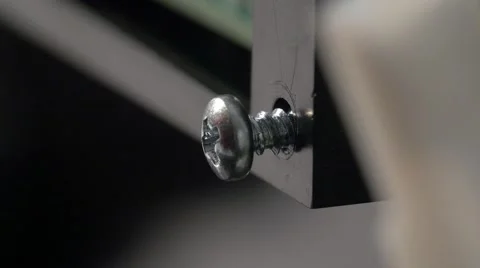 Tightening a screw close up Stock Footage 60419011