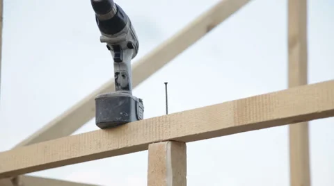 Tightening the screw in the construction beams Stock Footage 51611949