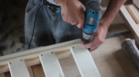 Tightening the screws in the Board Video stock 66445919