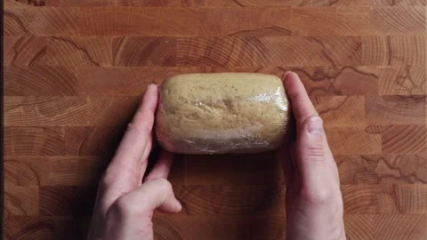 Tightly Wrapping Dough In Plastic Wrap By Hand Top View Видео 333597433