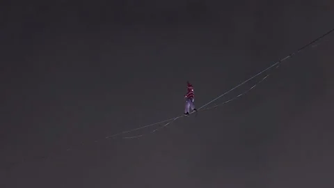Tightrope walker trying to maintain balance Stock Footage 220930702