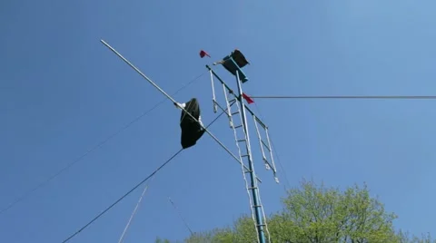 Tightrope walking on a high rope stretched Stock-Footage 63313221