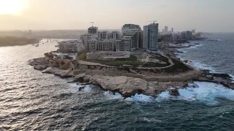 Tigne point sunset dusk wide aerial view sliema malta warm fading light Stock Footage 341799230