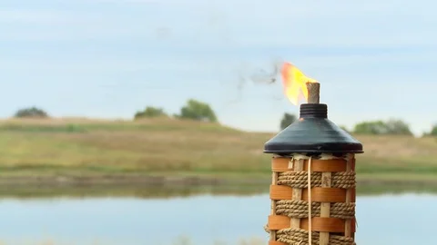 Tiki light by waterfront Stock Footage 96546665