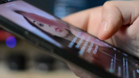 Tiktok social network app by bytedance. tik tok application on phone. Stock Footage 302344856