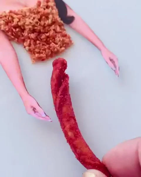 TikToker creates tiny outfit for Kim Kardashian using spicy chips from her Video stock 272884420