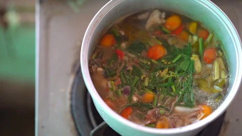 Tilapia fish soup or tom yum fish in pot is Thailand food, cooking delicious 库存影片 111818389