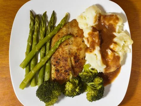 Tilapia  with vegetables and mashed potatoes Stock Photos