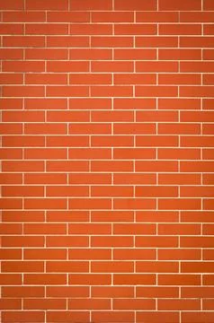 The tile background is in the style of orange brickwork Stock Photos
