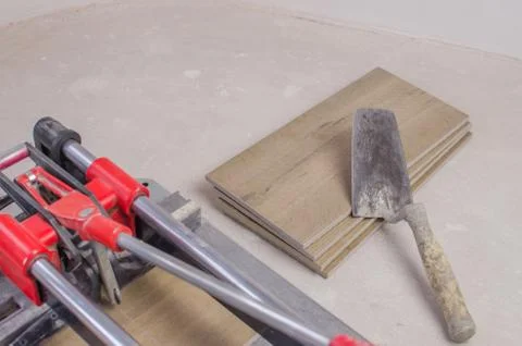 Tile cutter with ceramic tiles and ruler. Stock Photos