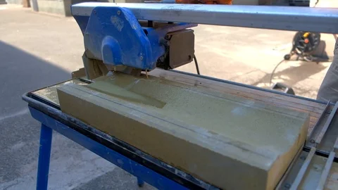 Tile cutter mashine in work of fitting the concrete stone Stock-Footage 97263087
