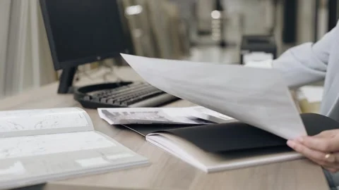 Tile designer reviews documents in salon Stock-Footage 276620874