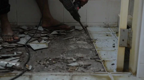 The tile floor demolishing by the constructor Stock Footage 27795541