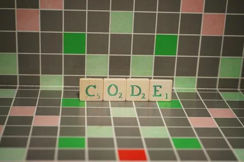 Tile with green code text on a blocked background Foto stock