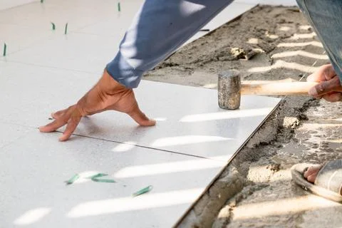 Tile installation process home renovation diy project construction site clo.. Stock Photos