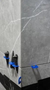 Tile installed on a wall with a 45 degree angle cut Stock Photos