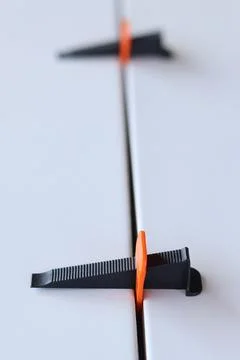 Tile laying process using plastic clamps. Close-up of tile leveling system Stock Photos