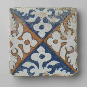Tile with leaf patterns. Tile with multicolor (blue and orange) painted le... Stock Photos