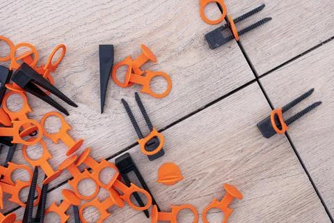 Tile leveling system with plastic clips and wedges. repair school Stock Photos