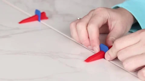 Tile leveling system in the process of work 스톡 동영상 339092290