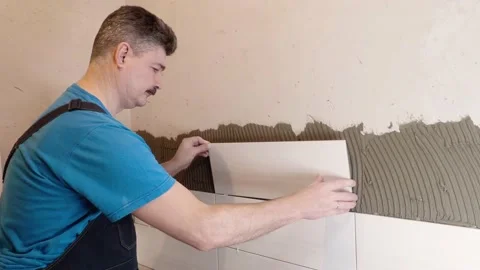 Tile maker performs the work of laying tiles Video stock 169308842