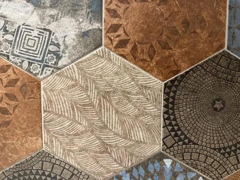 Tile mosaic with geometric patterns in earth tones as decorative architectu.. Fotos Stock