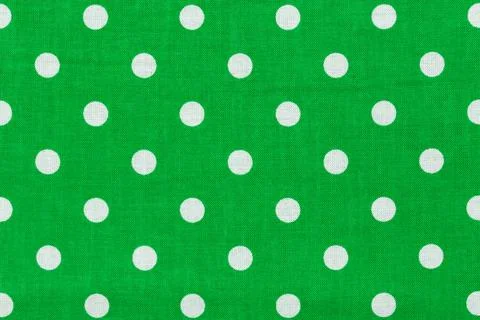 Tile pattern with white polka dots on green background. Stock Photos