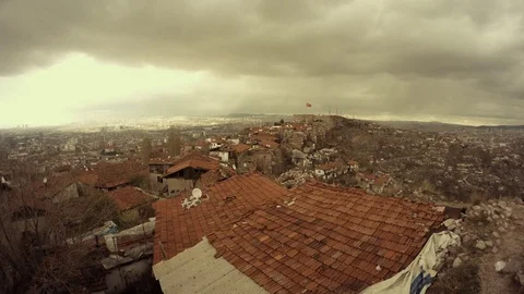 Tile roofs top view on Ankara far turkish flag cloudy day Stock Footage 77874144