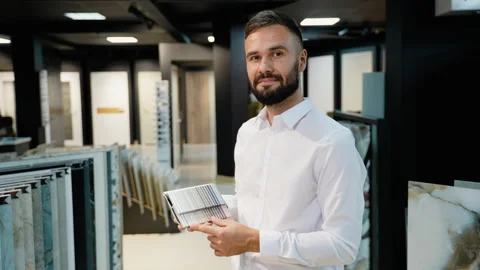 Tile Sales Consultant Ready to Assist Customers in Showroom Stock Footage 291721653