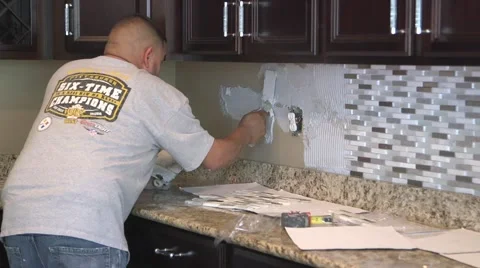 Tile setter, kitchen remodel 12 Stock Footage 44302762
