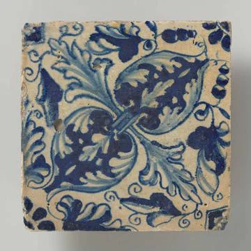 Tile. Tile with blue painted leaf patterns of oak leaf, placed diagonally.... Stock Photos