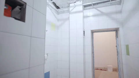 Tiled corridor features open doorway leading to another room 動画素材 335644362