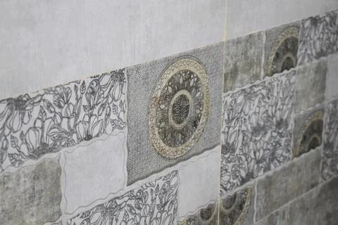 A tiled design on the wall. Stock Photos