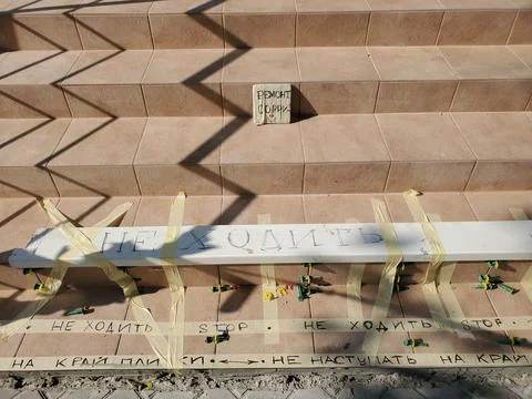 Tiled steps while renovation with precaution text - do not step, renovation Stock Photos