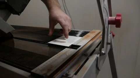 Tiler with a hand-held tile cutter cuts the tile on the floor Video stock 103113694