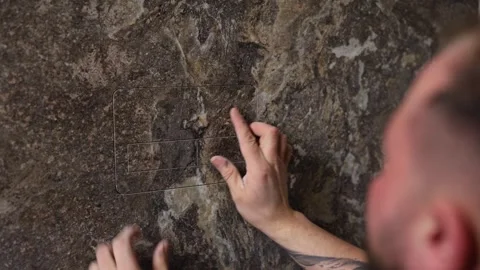 Tiler installing large format tile on bathroom wall Stock Footage 318900420