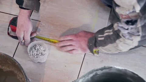 The tiler lays the tile close-up Stock Footage 103473221