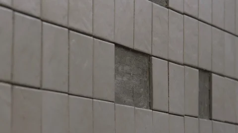 The tiler lays the tiles Stock Footage 112122306
