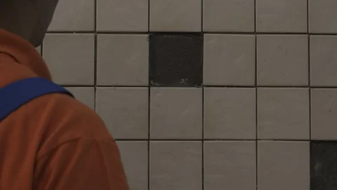 The tiler lays the tiles Stock Footage 112122390