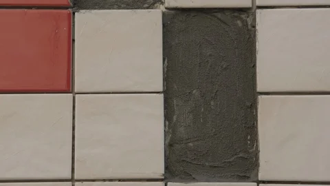 The tiler lays the tiles Stock Footage 112123024