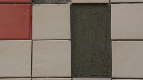 The tiler lays the tiles Stock Footage 112123704