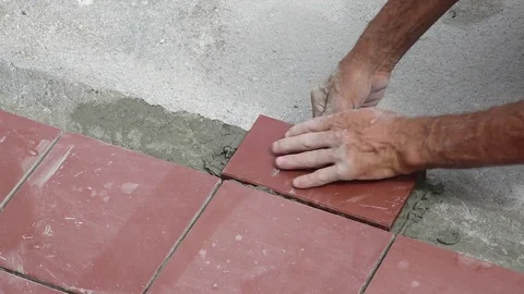Tiler restoring sidewalk layin Vídeo Stock 101480781