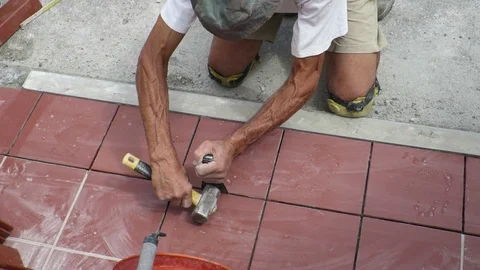 Tiler restoring sidewalk layin Stock Footage 101480782