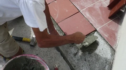 Tiler restoring sidewalk layin Stock Footage 101480788