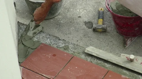 Tiler restoring sidewalk layin Stock Footage 101480789