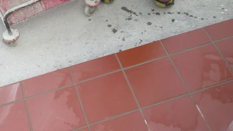 Tiler restoring sidewalk layin Stock Footage 101480885