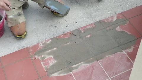 Tiler restoring sidewalk layin Stock Footage 101480887